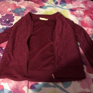 Maroon jacket.